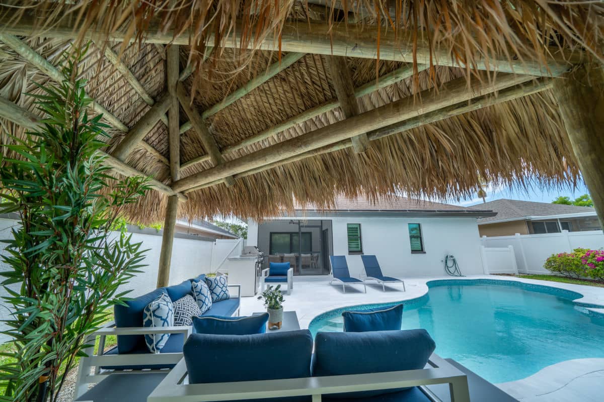 Poolside tiki built with chairs looking over the pool.